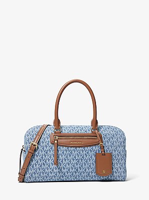 Jet Set Travel 中号旅行包，采用标志性印花牛仔布制成，配有肩带